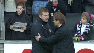 MK Dons manager Karl Robinson embraces AFC Wimbledon boss Neil Ardley after their FA Cup 2nd Round tie, December 2012