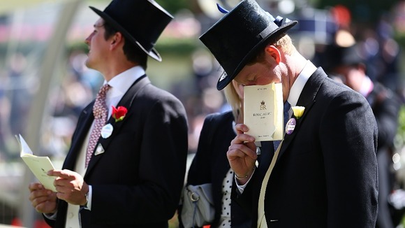 The Prince peers into his race card.