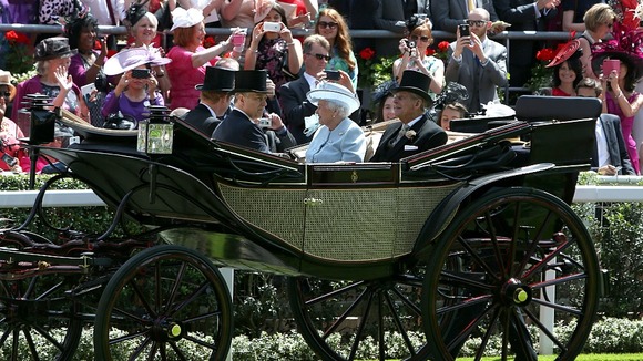 The Queen arrives with Princes Harry, Andrew and Philip.