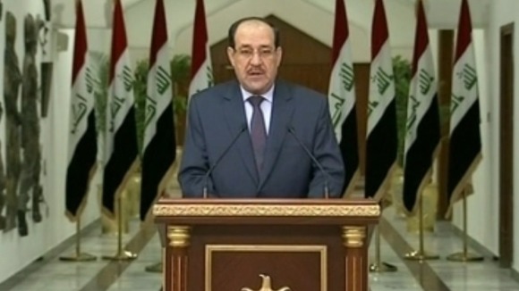 Iraqi Prime Minister Nouri Al-Maliki addressing the nation on television.