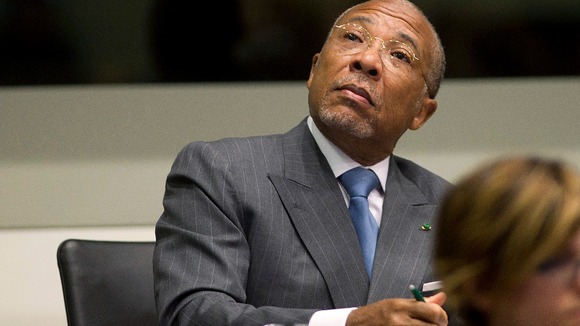 The former Liberian president says he is being kept from his family in Africa and is a "breach of human rights".