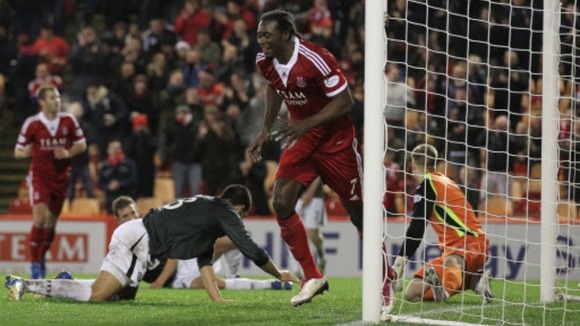 Calvin Zola scores for Aberdeen last season.