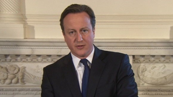 David Cameron making a statement about the men's deaths.