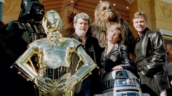 Star Wars creator George Lucas with Carrie Fisher, Mark Hamill and some of the series' most famed characters.