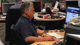 Keith Wilkinson in studious form in the newsroom
