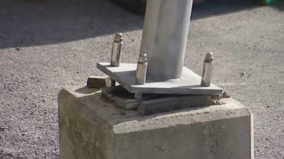 Leaning post at Weymouth harbour wall