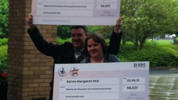 John and Karen Ord with their identical cheques