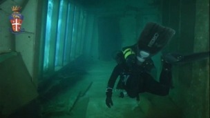 A diver explores the corridors of the wrecked luxury cruise liner, which sank ff the coast of Isola del Giglio in Italy in 2012.