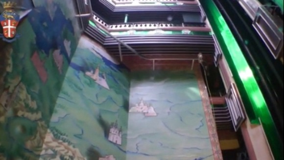 Police divers filmed inside the sunken Costa Concordia.