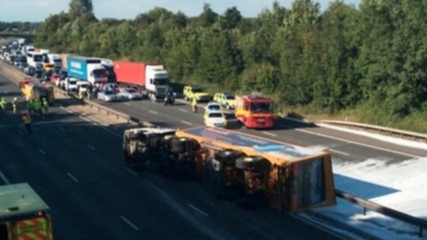 The overturned lorry on the M11 in Essex which spilled acid over both carriageways.
