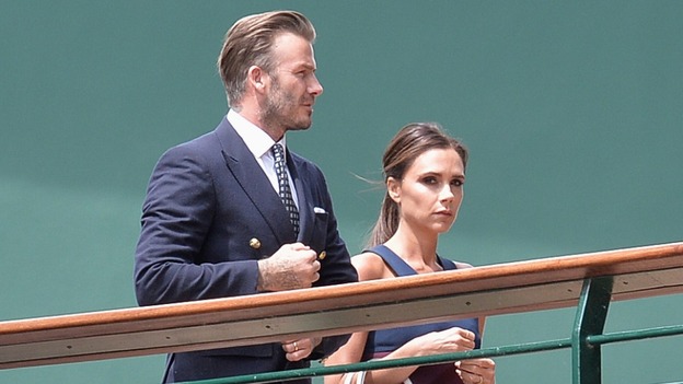 David and Victoria Beckham make their way to the match.