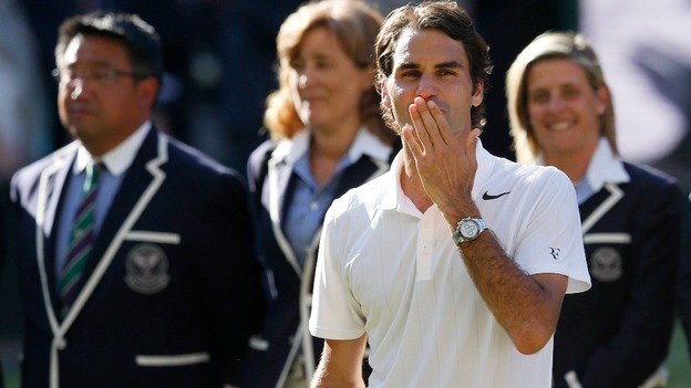 Roger Federer blows a kiss to the crowds after his defeat by Novak Djokovic.
