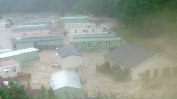 Scene at Welsh caravan parks after severe flooding.