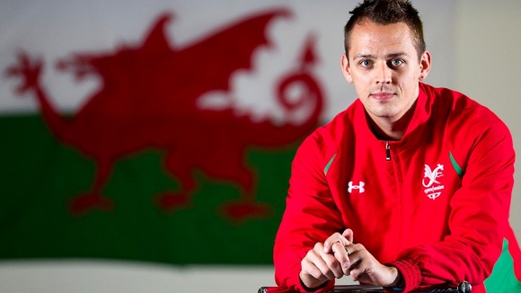 Badminton player Nick Strang models Wales' colours.