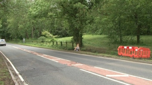 Police close the road where the crash happened that left three dead and one critical