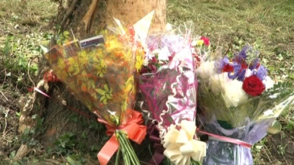 Flowers have been placed at the scene of the crash