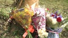 Flowers have been placed at the scene of the crash
