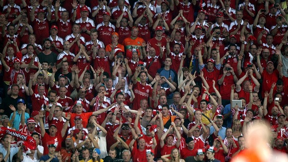 Denmark fans celebrate their win over Holland.