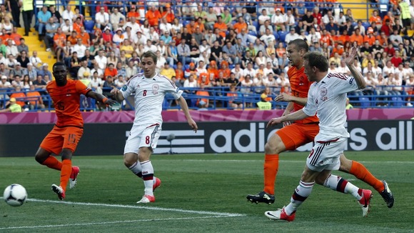 Denmark striker Michael Krohn-Delhi scores for Denmark.