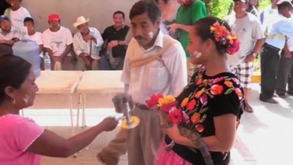 A woman burned incense around the 'princess' crocodile's before the ceremony.
