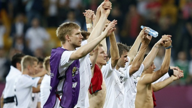 The Germany players applaud their fans.