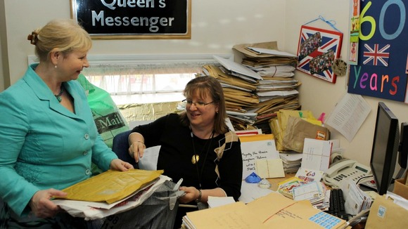 Staff in the Correspondence Office at Buckingham Palace, London with letters sent to Queen Elizabeth II for her Diamond Jubilee.