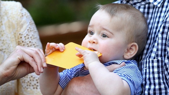 Little George's classic outfits are becoming a fashion hit but he's more interested in cards.
