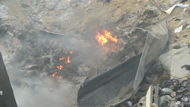 Fire was still burning in the rubble of the building hours after the attack.