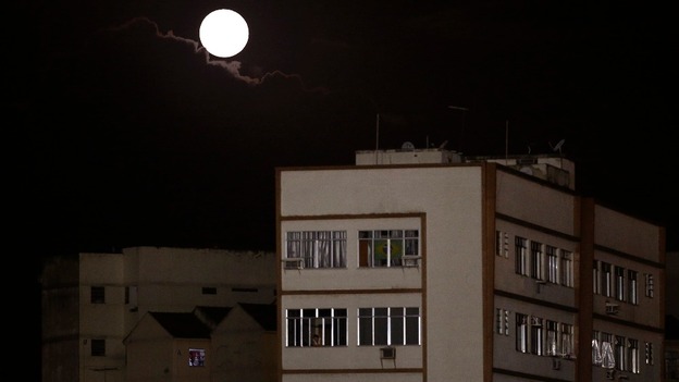 A moon is seen over the neighbourhood of Vasco da Gama in Brazil.