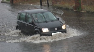 Beccles Road in Gorleston, Norfolk flooded by torrential rain.