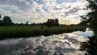 Summer skies reflected in the River Waveney at Bungay in Suffolk.