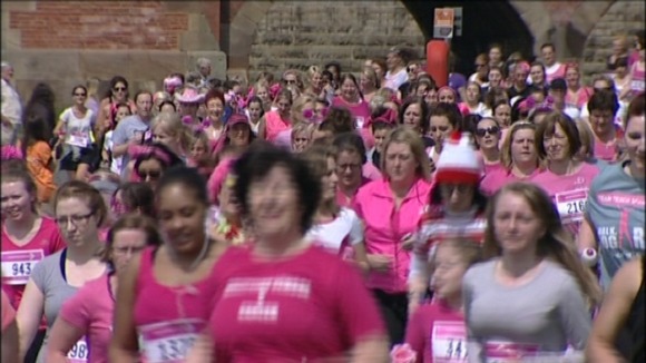 Hundreds of women wearing pink for the charity run