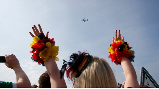 Fans in the capital cheered as the players' flight arrived overhead.