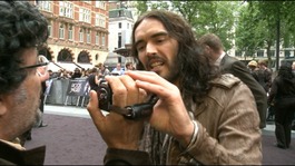 Russell Brand grabs a camera