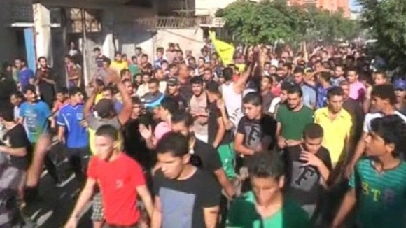 Hundreds gather to mourn the 4 boys, killed earlier today by naval gunfire.