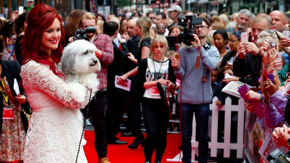 Ashleigh Butler and Pudsey pose for photographs at the premiere of their new film in London.