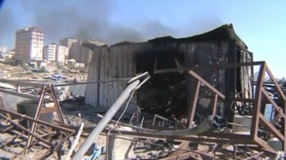 The wreckage of a shipping container that bore the brunt of one of the strikes.
