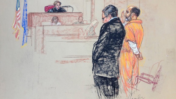 Babar Ahmad, pictured here in orange as he appeared in a US court in 2013, has been jailed for 12.5 years.