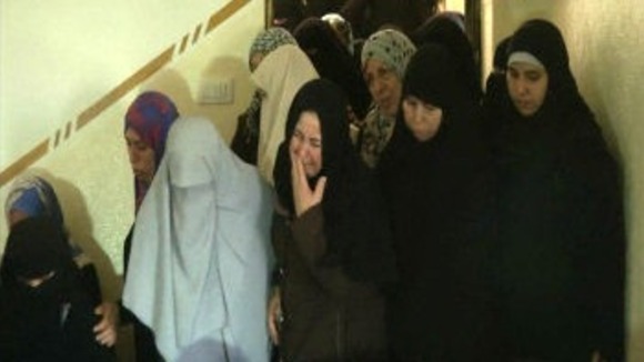 Women mourn as funeral held for four Palestinian children killed