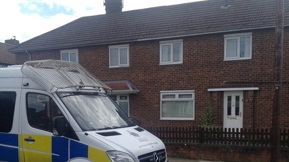 Police outside of woman's home in Middlesbrough.
