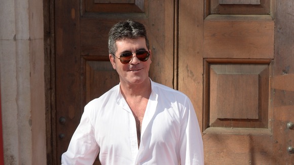 Simon Cowell's spokesman responds to claims the X Factor boss is gay.