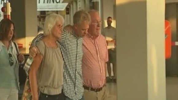 Passengers seen being comforted as news of the Malaysia Airlines plane rolls in