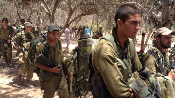 Israeli troops mustering near the border.