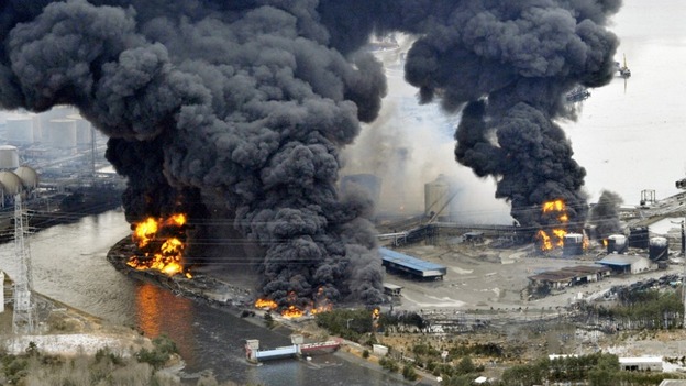 A factory burns following an earthquake and tsunami in Sendai in March 2011