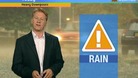 Simon Parkin in front of weather chart