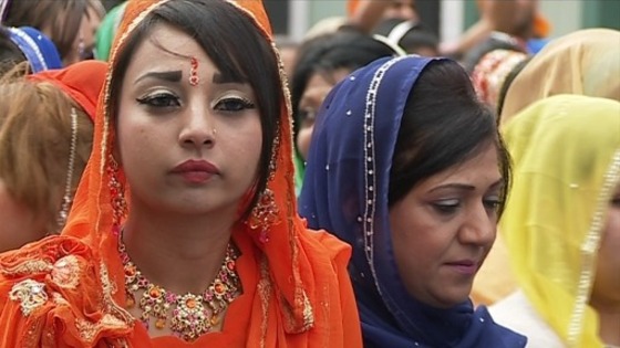 Many dressed in blue and orange