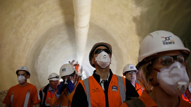 Crossrail workers in one of the scheme's tunnels beneath Whitechapel station