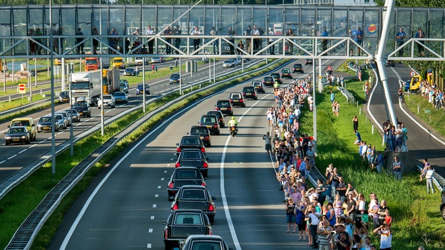 Thousands turn out to line the route of a convoy of hearses, bearing remains of the victims of the Malaysia Airlines Flight MH17 crash, as they make their way to Hilversum, Holland.