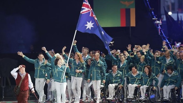The flag of Australia is carried by Anna Meares during the opening ceremony.