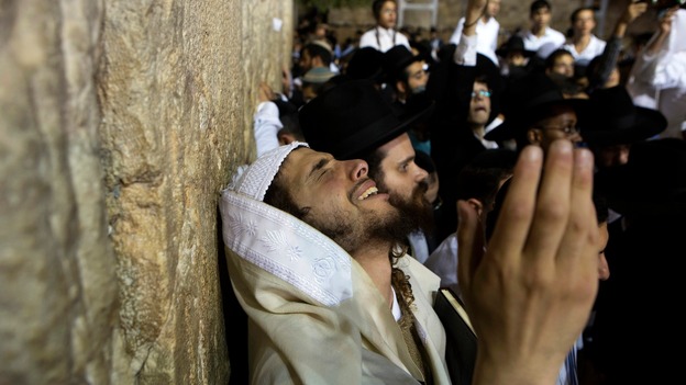 A Jewish worshipper takes part in a special prayer at the Western Wall in Jerusalem's Old City for the well-being of Israeli soldiers.
